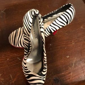 Black and white heels with red heel